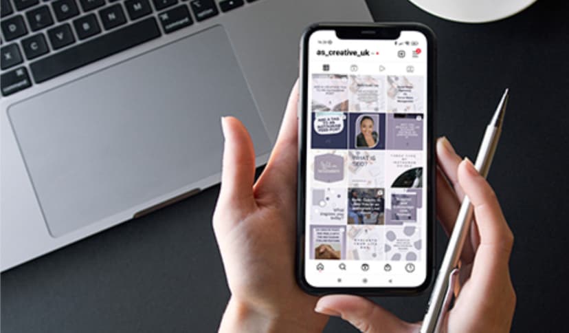 An image displaying a social media feed on a mobile phone managed by AS Creative.